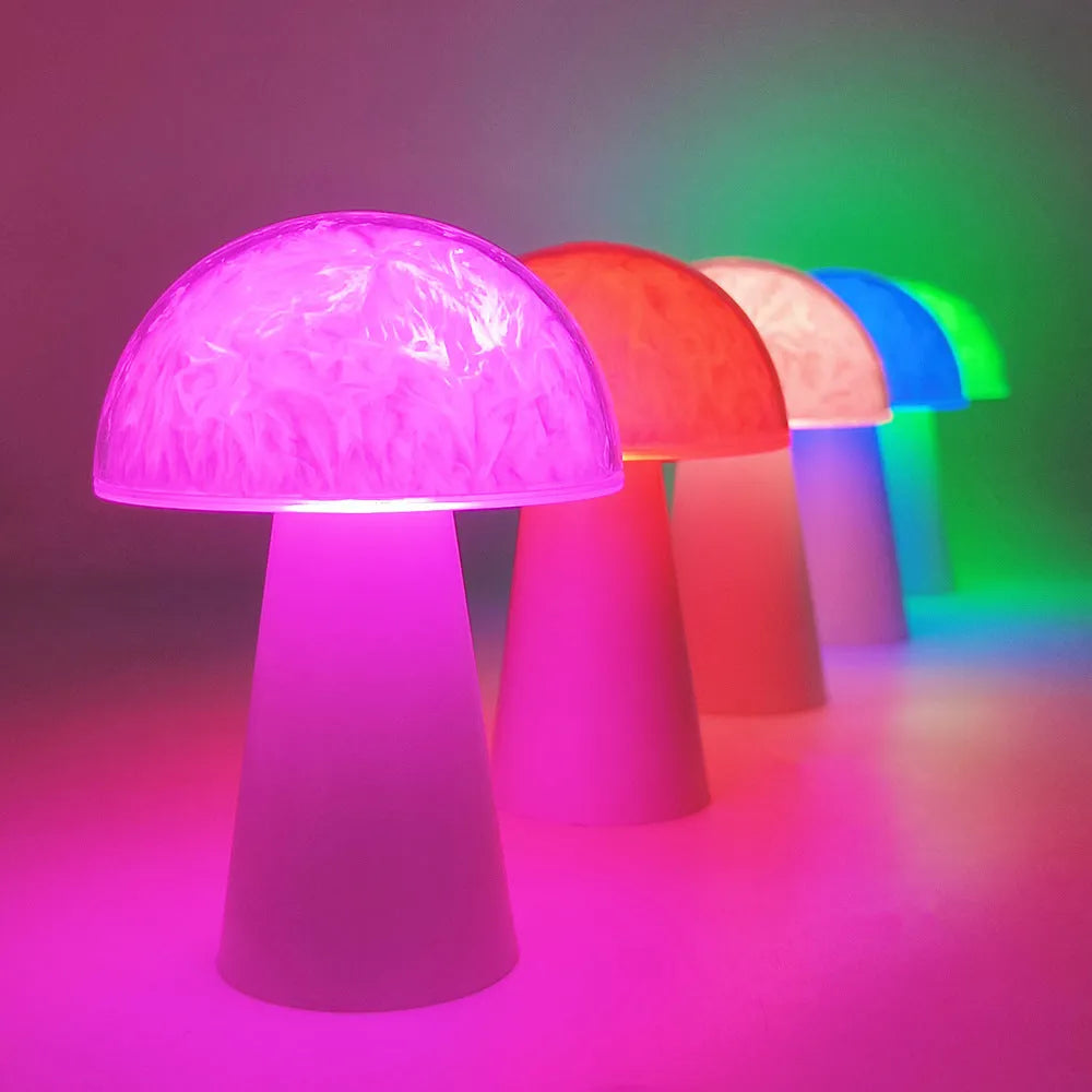 Mushroom-shaped RGB colour-changing ambience light with remote control on wooden surface