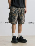 Loose fit straight-leg denim shorts in black shown on a hanger.