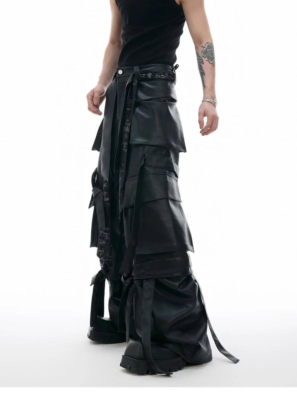 Black loose-fit retro trousers with quilted stitching pattern, multiple pockets, and ribbon trim detail.