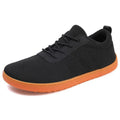 Men's black Flyknit walking shoes with wide round toe and non-slip rubber sole shown from side view