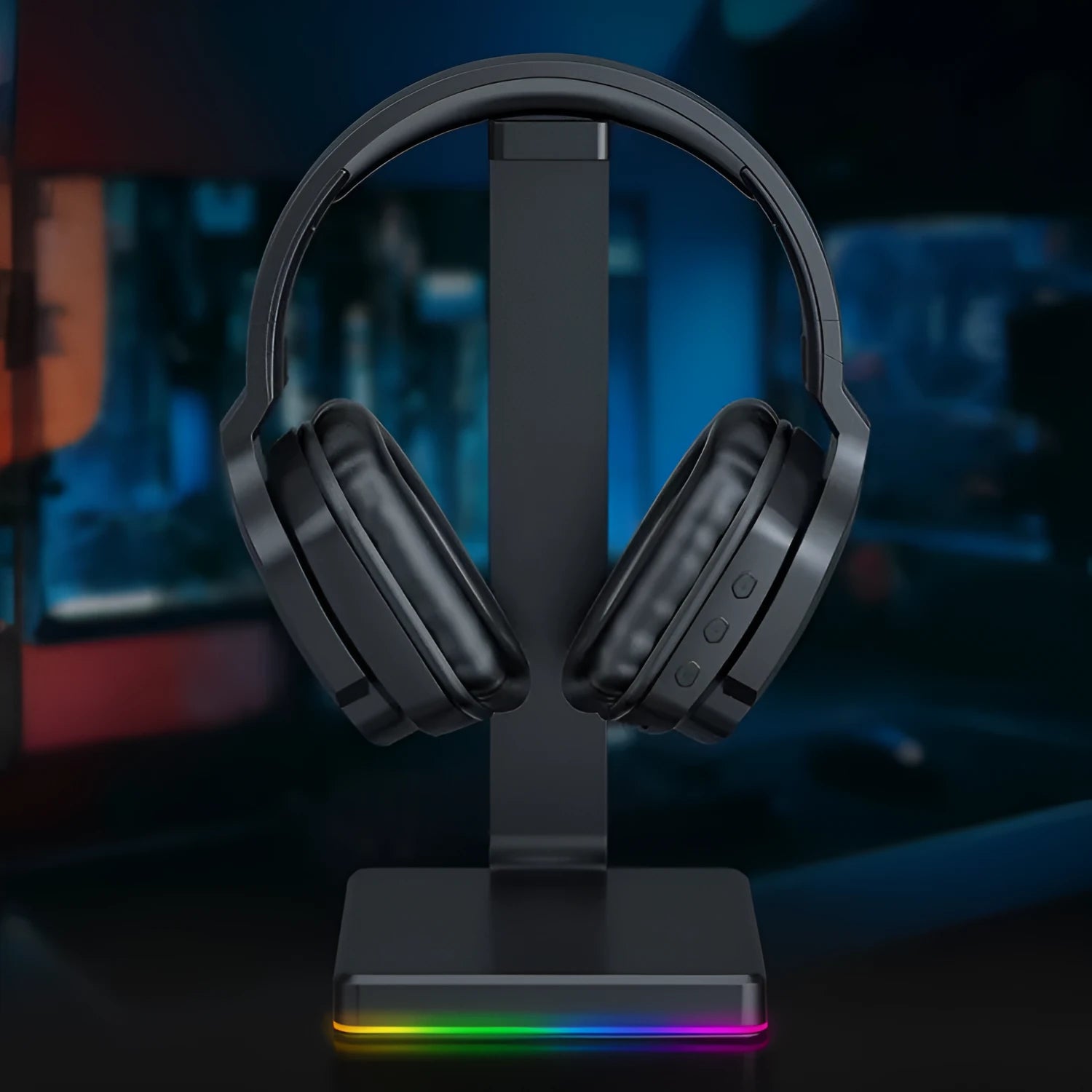 Luminous black wireless over-ear gaming headphones shown with a 3.5mm audio cable and dust bag.