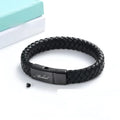 Black stainless steel bracelet with leather cinerary charm and engraved text, presented in a gift box.