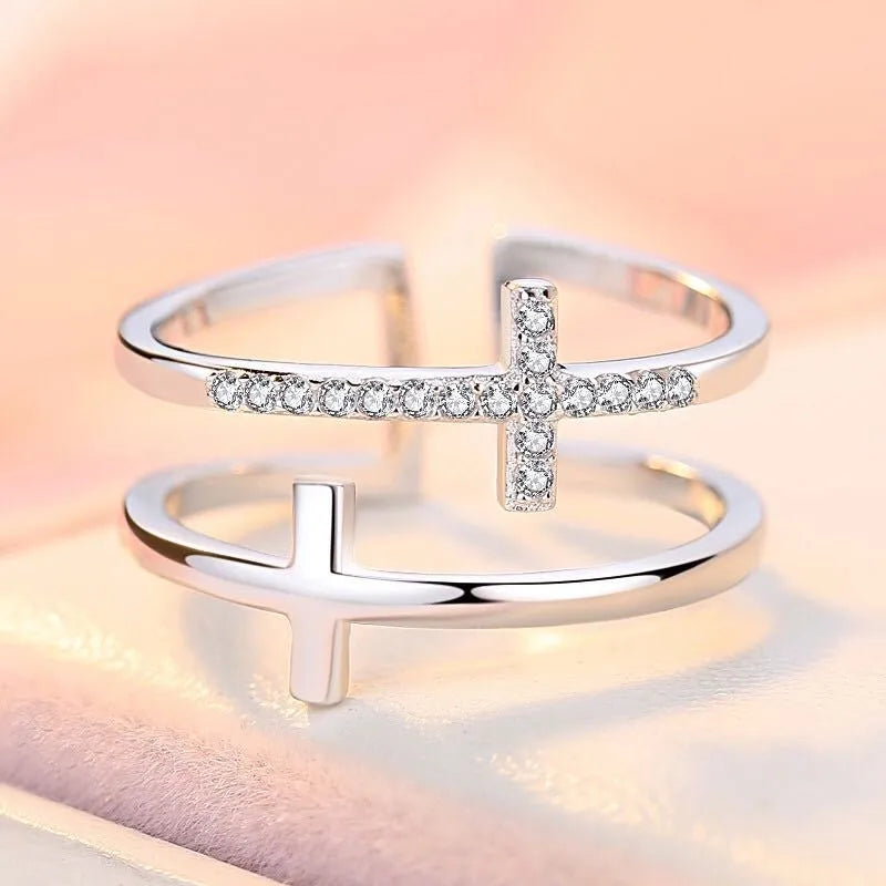 Adjustable copper ring with zircon stones in geometric design, showing open ring construction