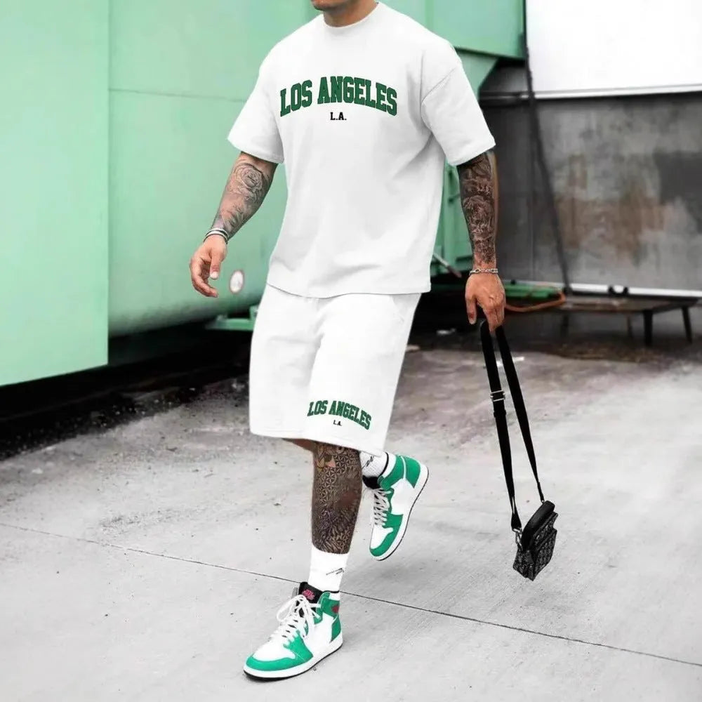 Man wearing a matching 3D printed letter design short sleeve top and shorts in a sportswear setting.