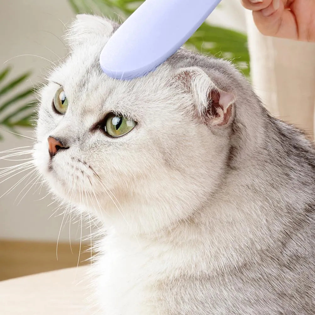 Grey dual-ended cat grooming comb with wide and narrow sections for pet hair removal and massage