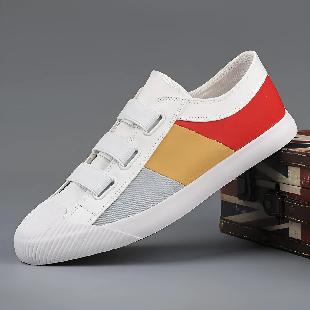 Men's beige canvas low-top sneakers with elastic band closure and a flat rubber sole.