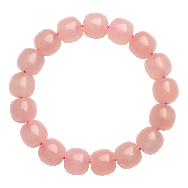 Natural pink crystal bracelet with barrel-shaped geometry beads measuring 8 x 10mm