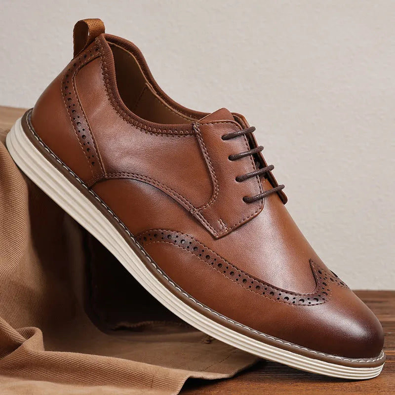 Men's black and brown slip-on business casual shoes with round toe and carved detailing