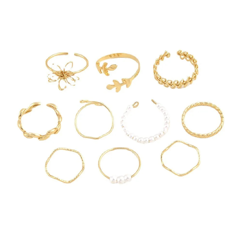 Gold-coloured alloy ring with openwork flower design and glossy electroplated finish
