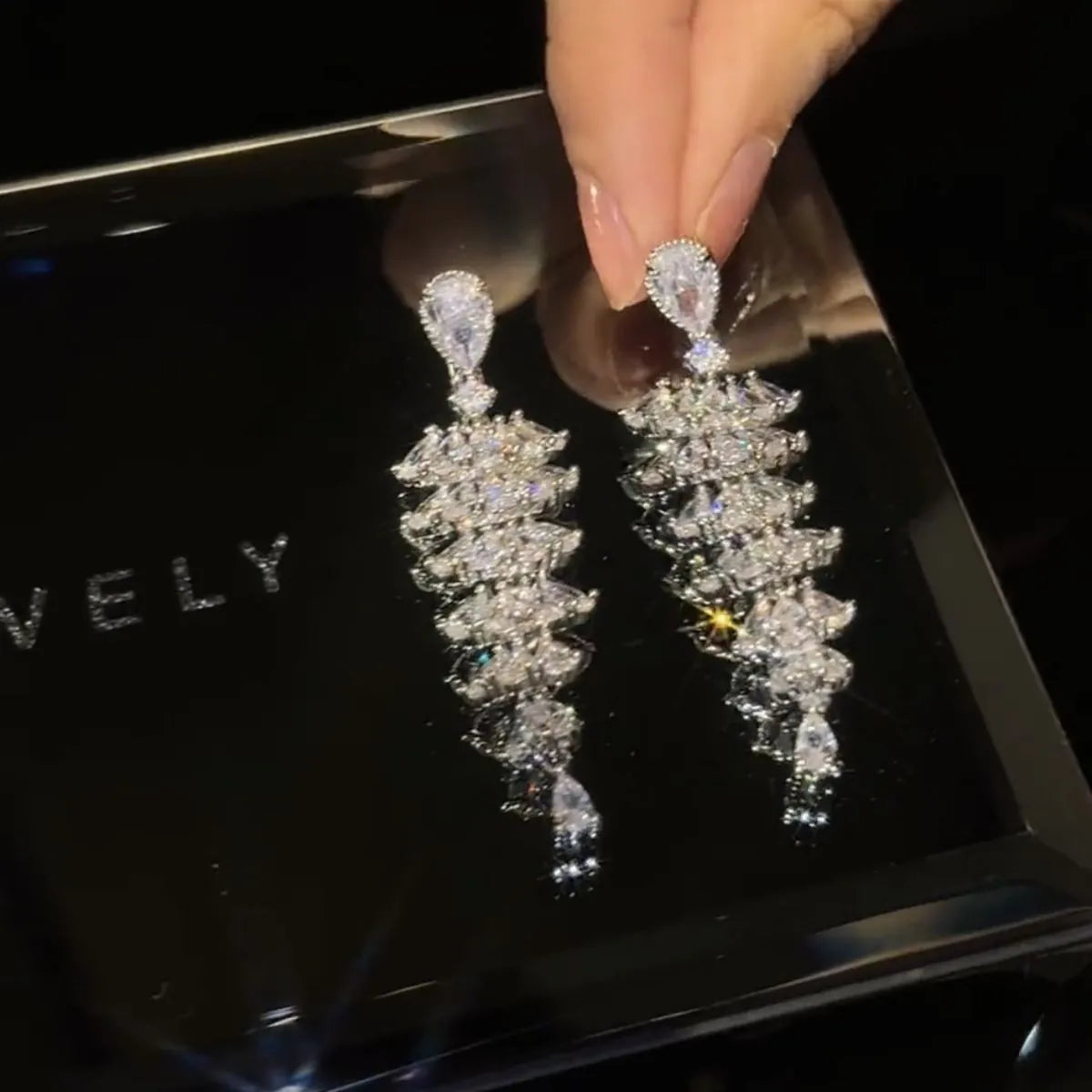 Silver pagoda Christmas tree drop earrings with sparkling zircon detailing and stud fastening