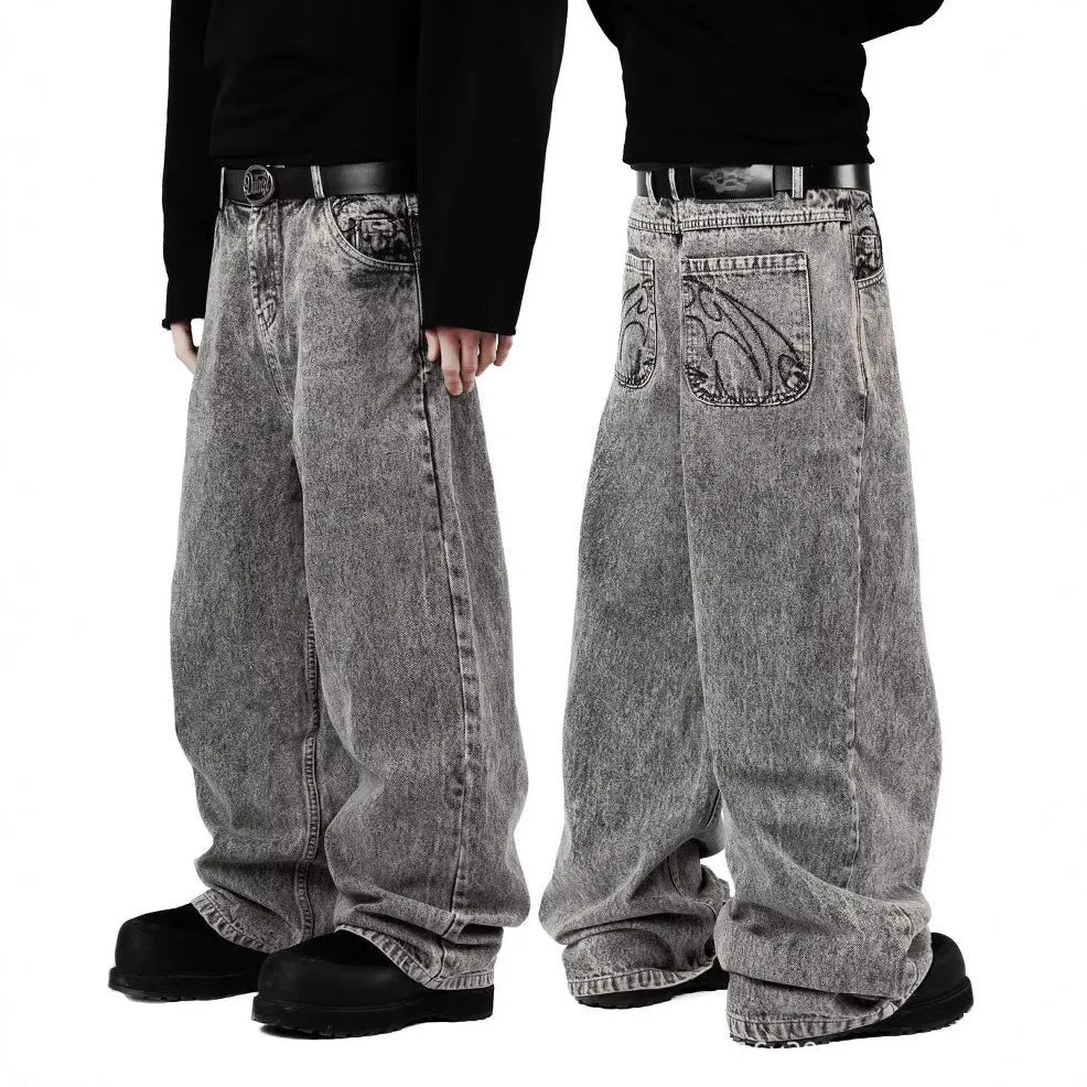 Grey loose fit straight-leg denim trousers for men and women on a mid-waist
