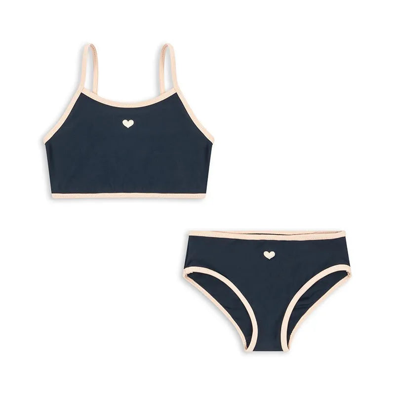 Dark blue split-style briefs swimsuit for baby girls, shown in sizes from 90cm to 130cm.