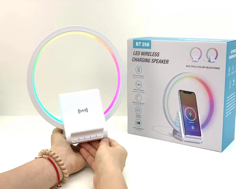 White Bluetooth speaker with wireless charging pad and ambient lighting, 225mm by 200mm dimensions