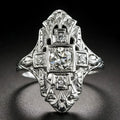 Hollow geometric silver-coloured ring with diamond-studded cubic zirconia stones, shown in profile view