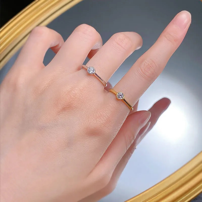 Minimalist silver crown-shaped ring with linear engraving detail in gold or platinum electroplated finish.