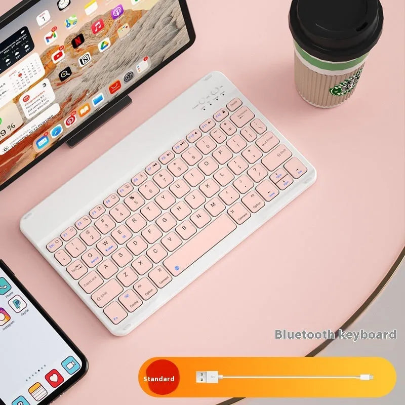 Girls Bluetooth tablet keyboard in multiple colour options including white, green, and pink on a desk