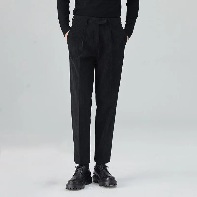 Men's straight-leg corduroy trousers in beige, black, and brown grey, showing mid-waist and micro elastic fabric detail.