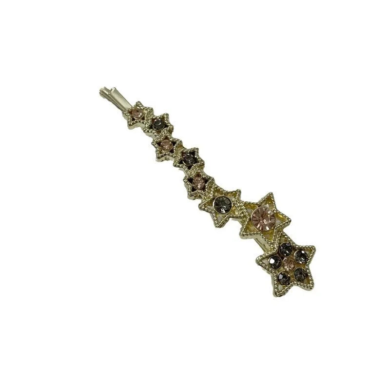Gold electroplated hair barrette with star decoration and side clip design for bangs