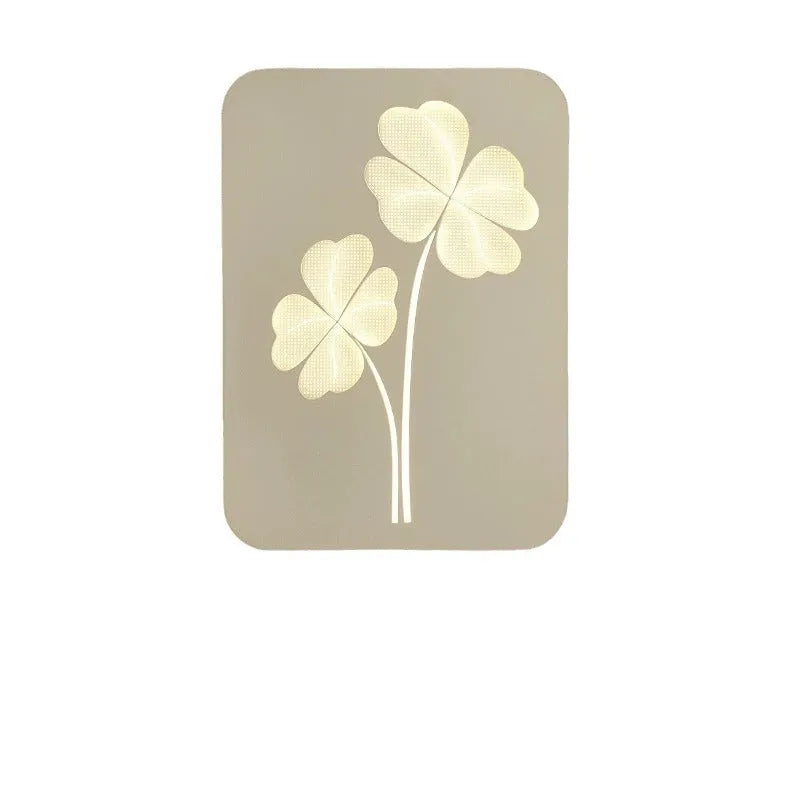 Modern cream bedside wall lamp with tricolour LED light and acrylic shade in love heart design