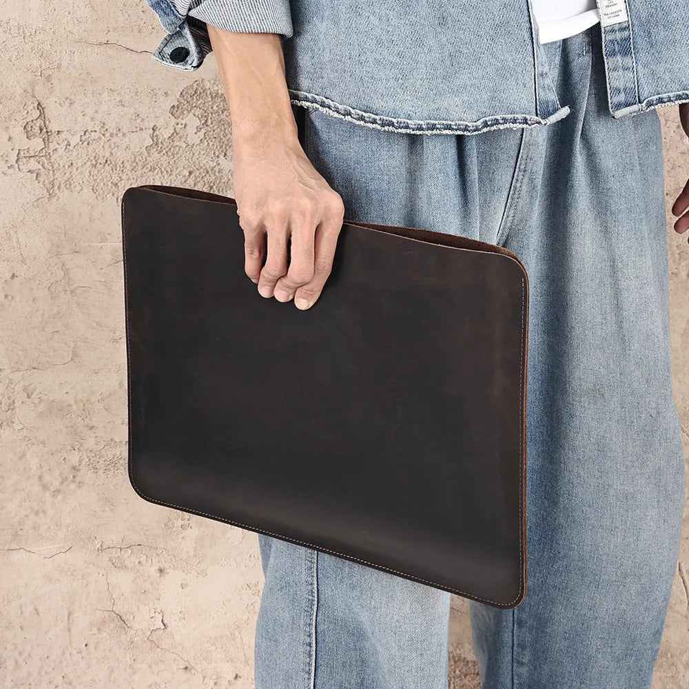 Computer liner bag in crazy horse leather with cowhide construction showing medium brown colour option