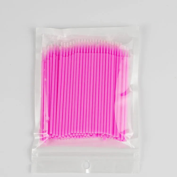 Disposable micro applicator brushes with bendable cotton tips and colour-coded handles for eyelash extensions