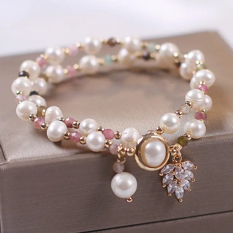 Women's double layer crystal bracelet with lucky cat charm and red cat's eye flower beads.