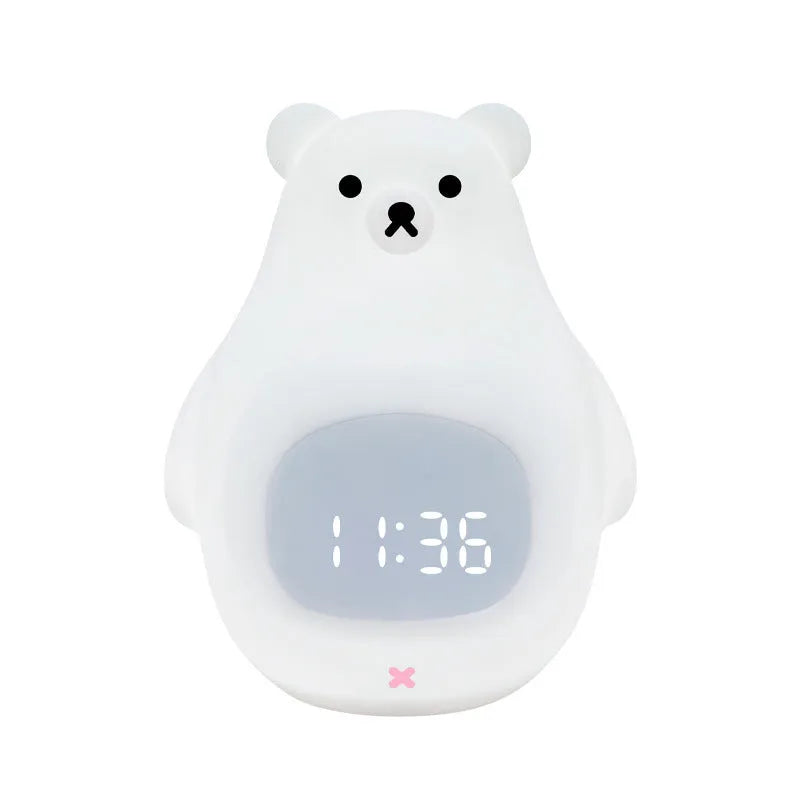 Big white bear shaped silicone night light with remote control on a table.