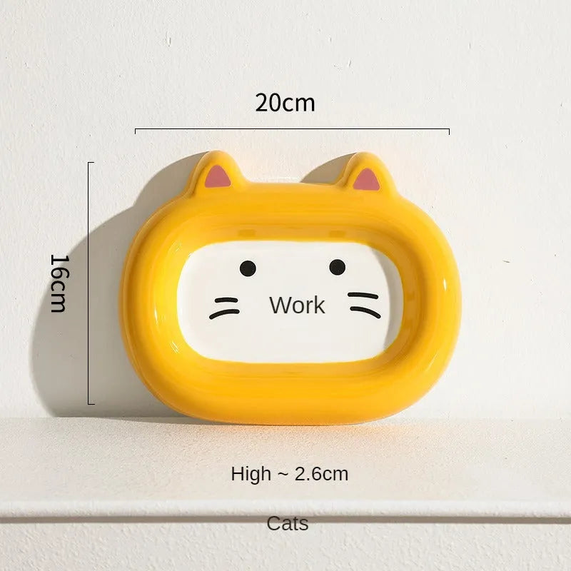 Ceramic pet bowl with an animal design, suitable for cat food or dog water.