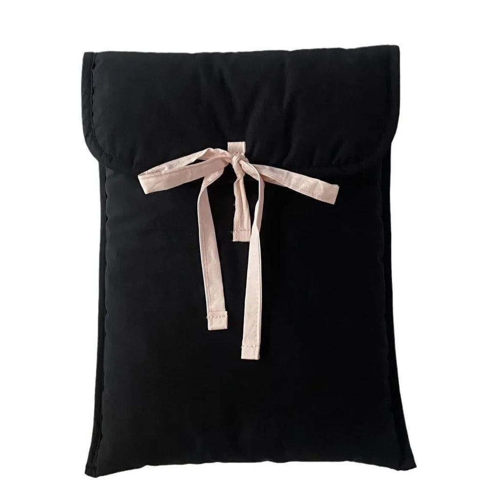 Women's black quilted laptop bag with ballet bow detail and striped pattern