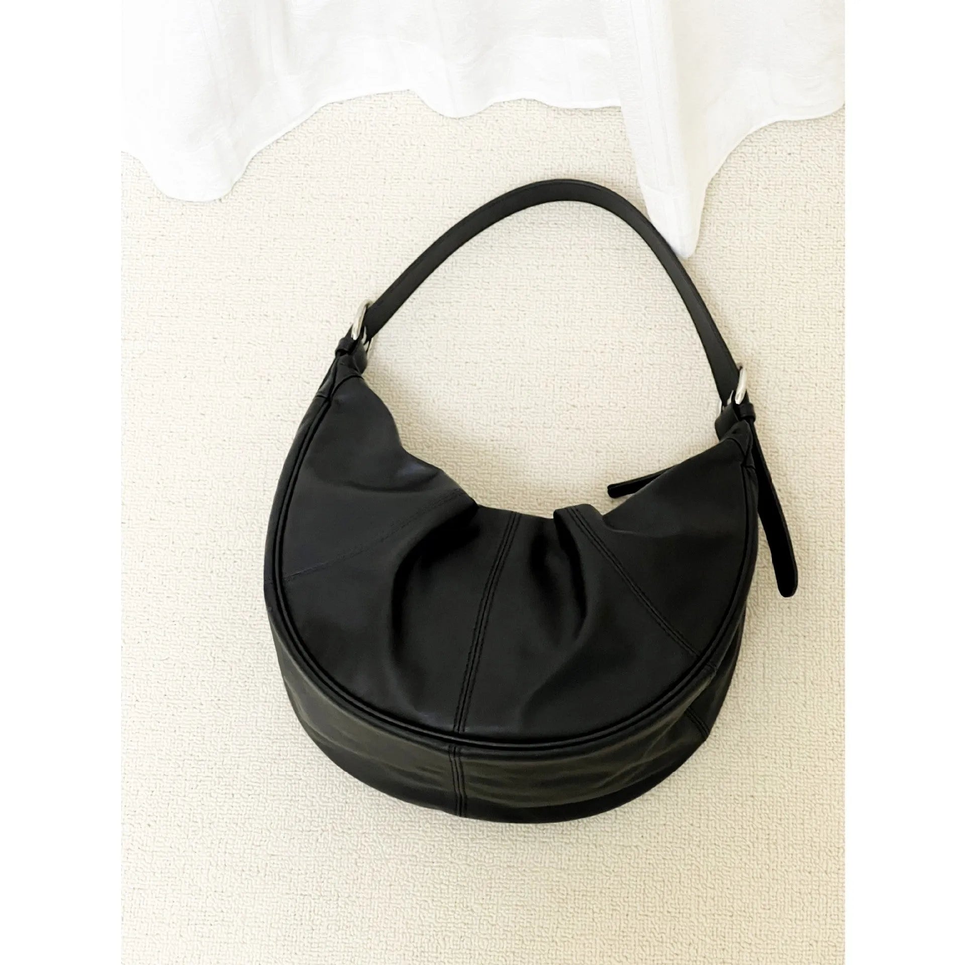 First layer cowhide shoulder bag in dumpling shape with double joint strap and sandwich pocket available in multiple colours