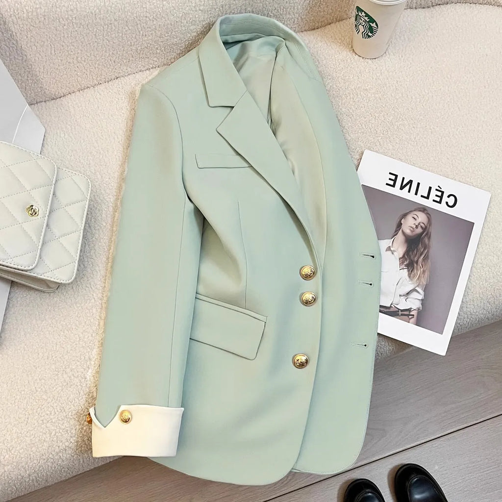 Korean style women's loose fit coat in milky white or black polyester with long sleeves and pockets