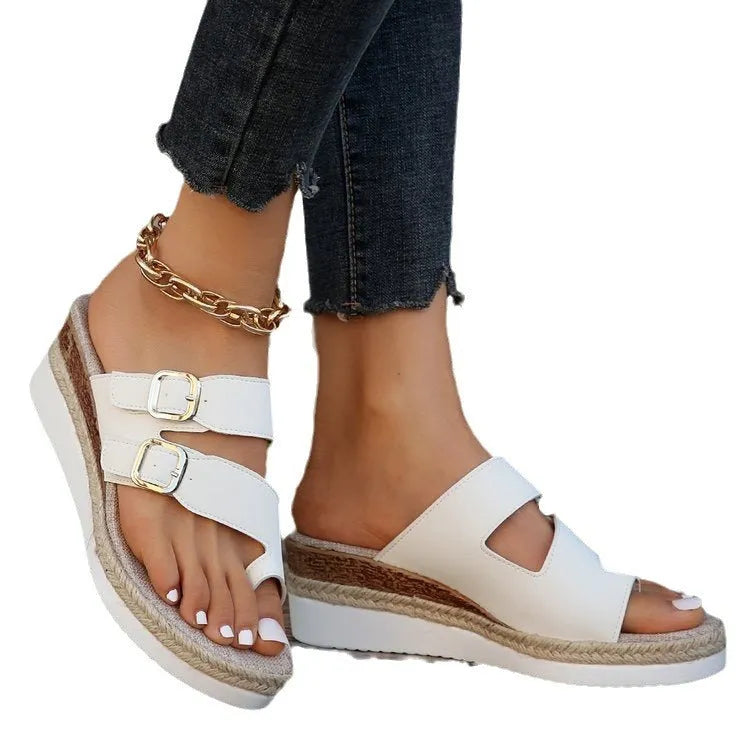White patent leather wedge sandals with peep toe woven design and finger fit construction