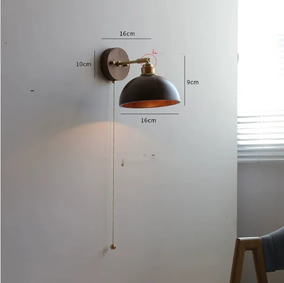 Nordic style wall-mounted bedside lamp in a wood colour finish.
