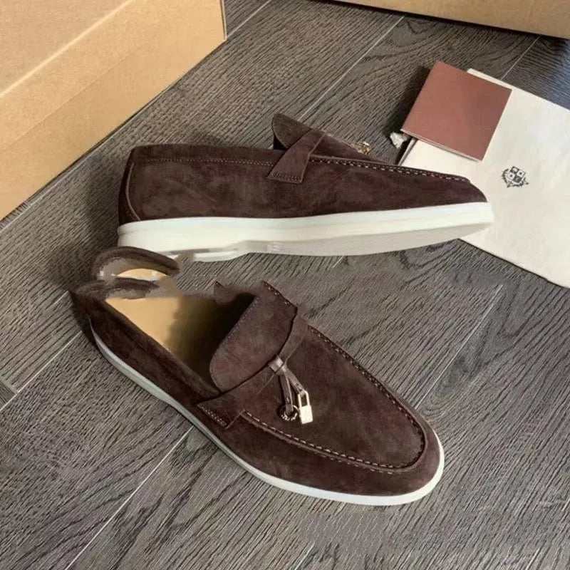 Slip-on high-top loafers in light gray with round toe and rubber sole.