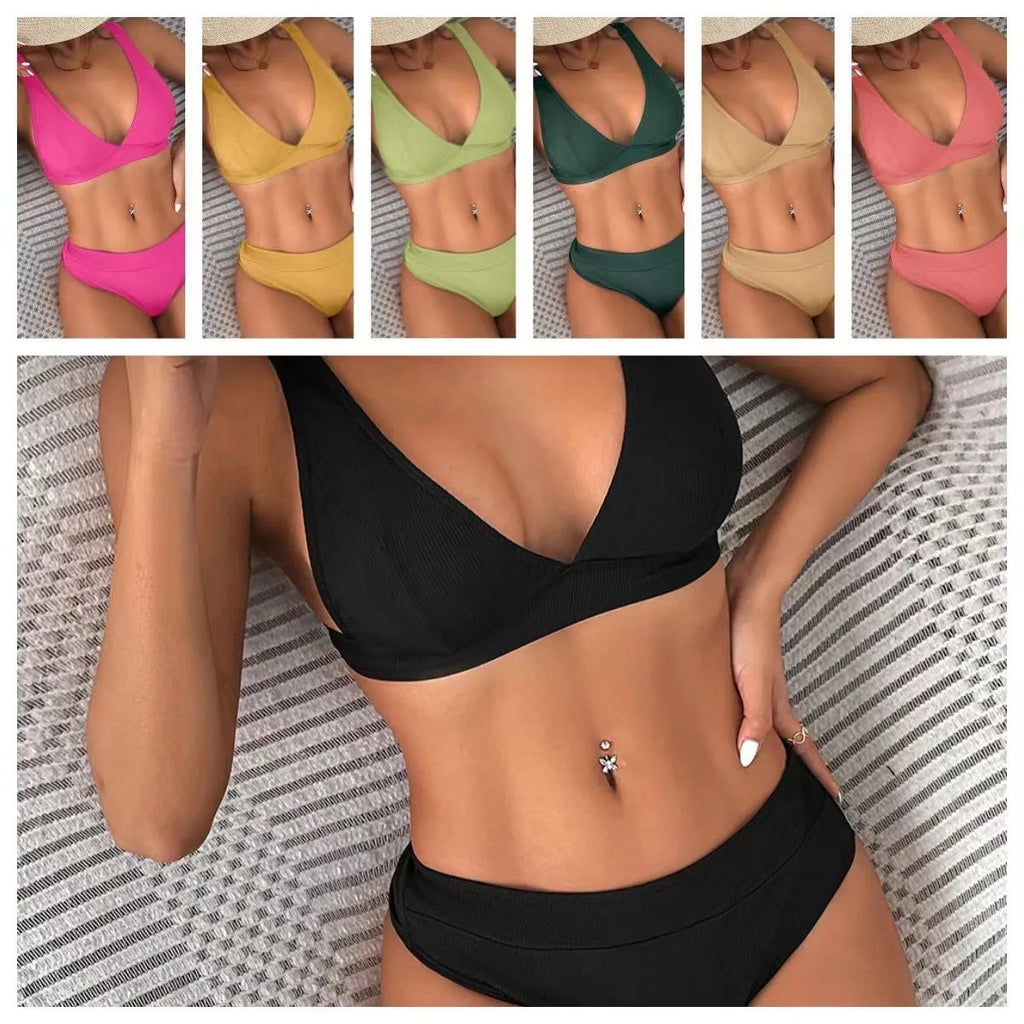 Women's black lace-up front bikini with high-leg split design on a neutral background.