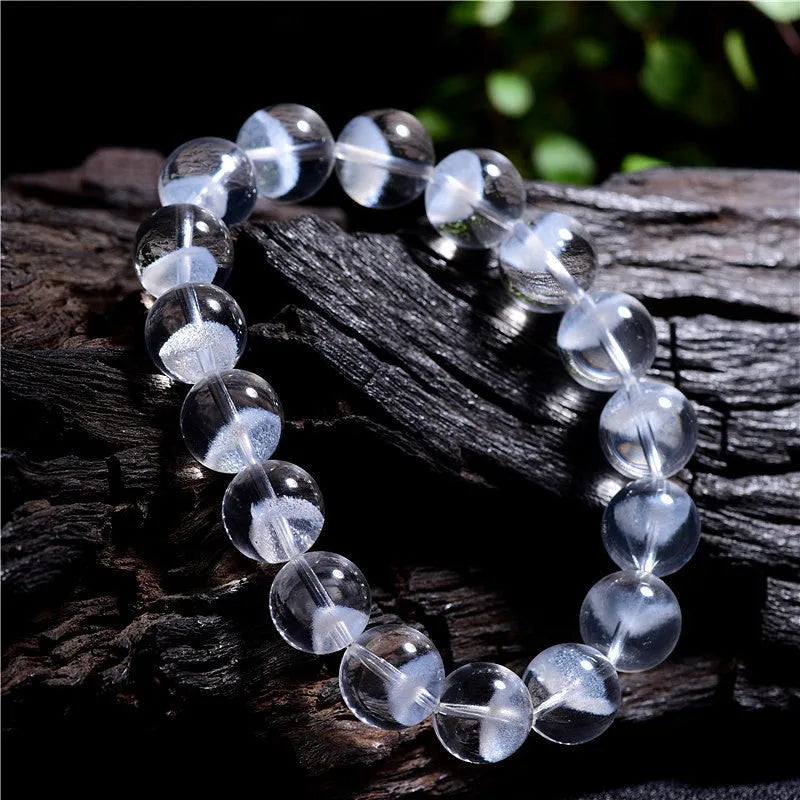 Women's white crystal ghost pyramid bead bracelet with Ruyi symbol design.
