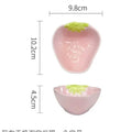 Porcelain dinnerware set with cute strawberry design showing straw hat plate, flower bowl, and twist spoon
