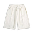Women's cropped wide-leg pants with rivet detailing in apricot, red or army green colours
