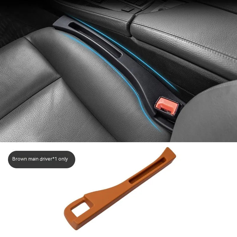 Black plastic car seat gap storage pocket with handle placed between vehicle seats.