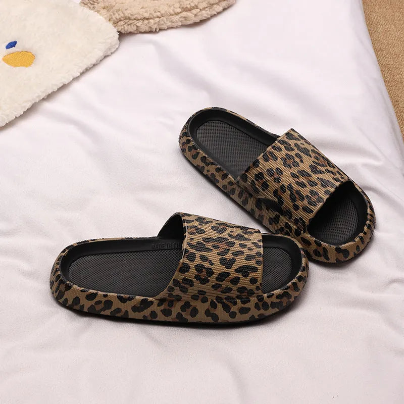 Women's leopard print slippers with thick EVA sole in black, pink, khaki, and white zebra print.