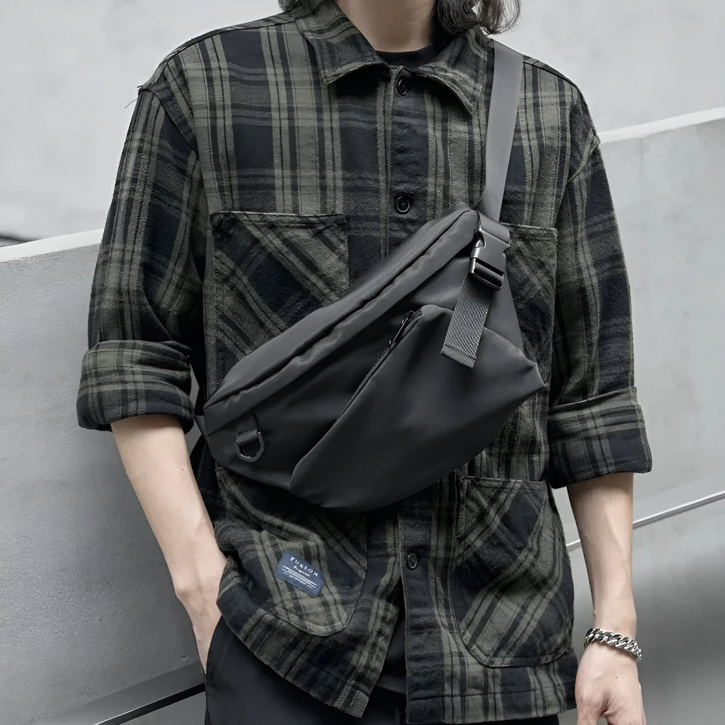 Black men's slanted chest bag made from Oxford fabric, showing sewing line details.