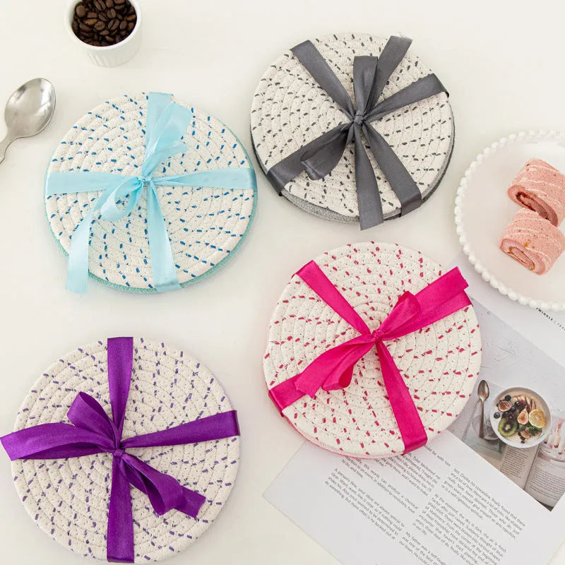 Three round 18cm cotton cord coasters in a set, shown in a blue colour option.