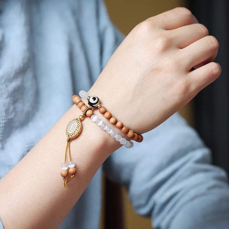 Sandalwood and opal double ring bracelet with polished finish and retro style.