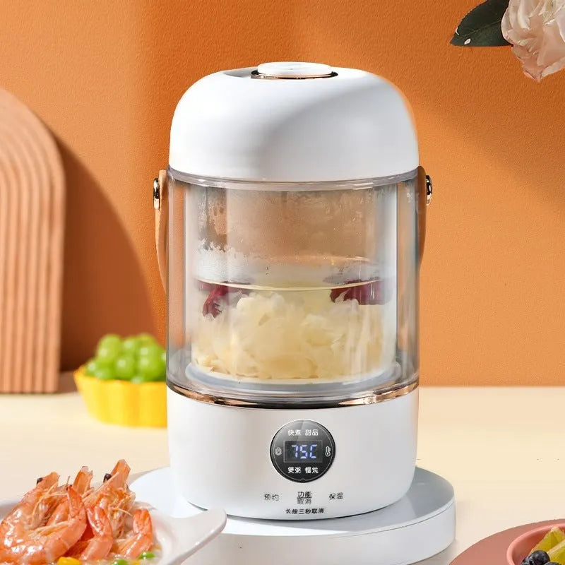 Compact white electric stew cooker with glass pot and digital display, shown with spoon.