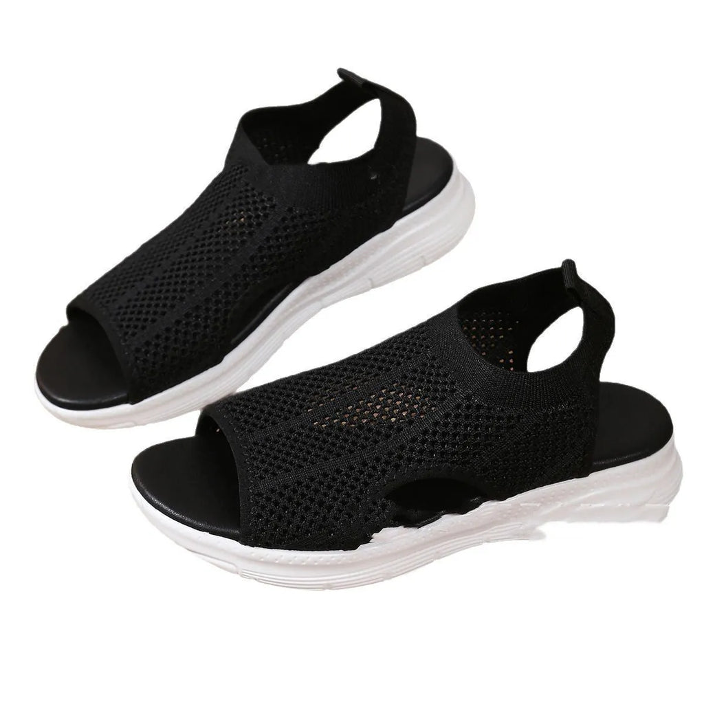 Women's flat platform sports sandals in black with mesh lining and a rubber sole.