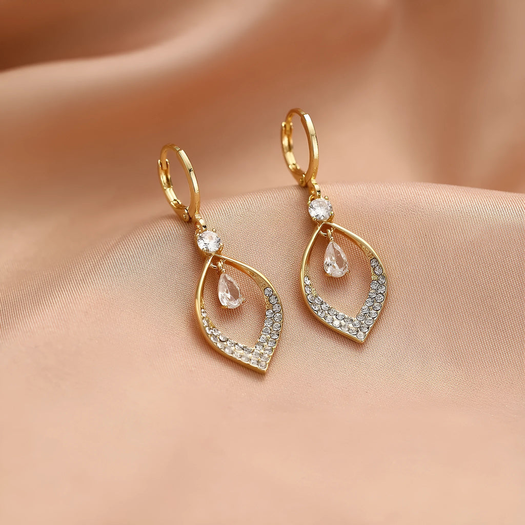 Gold and silver coloured women's teardrop zircon tassel earrings on a copper base.