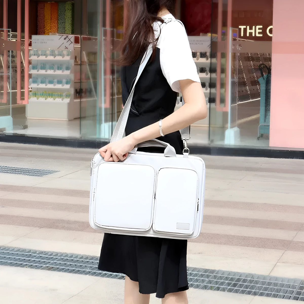 Shock proof shoulder laptop bag in black, grey or pink, polyester with retractable handle and zipper, sizes 13.3 to 15.6 inches.