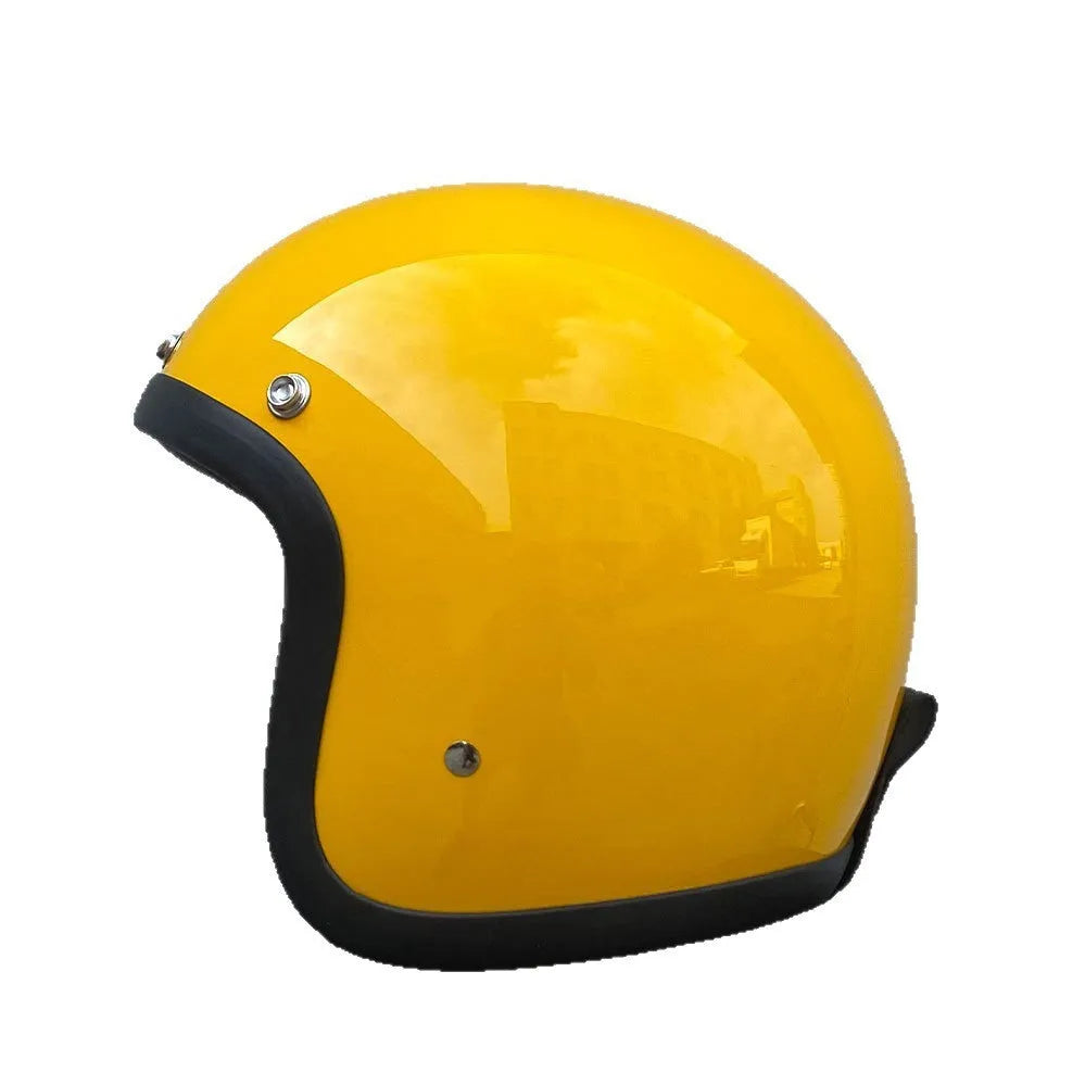 Retro-style half-shell motorcycle helmet in fibreglass, shown in a cement grey colour option.