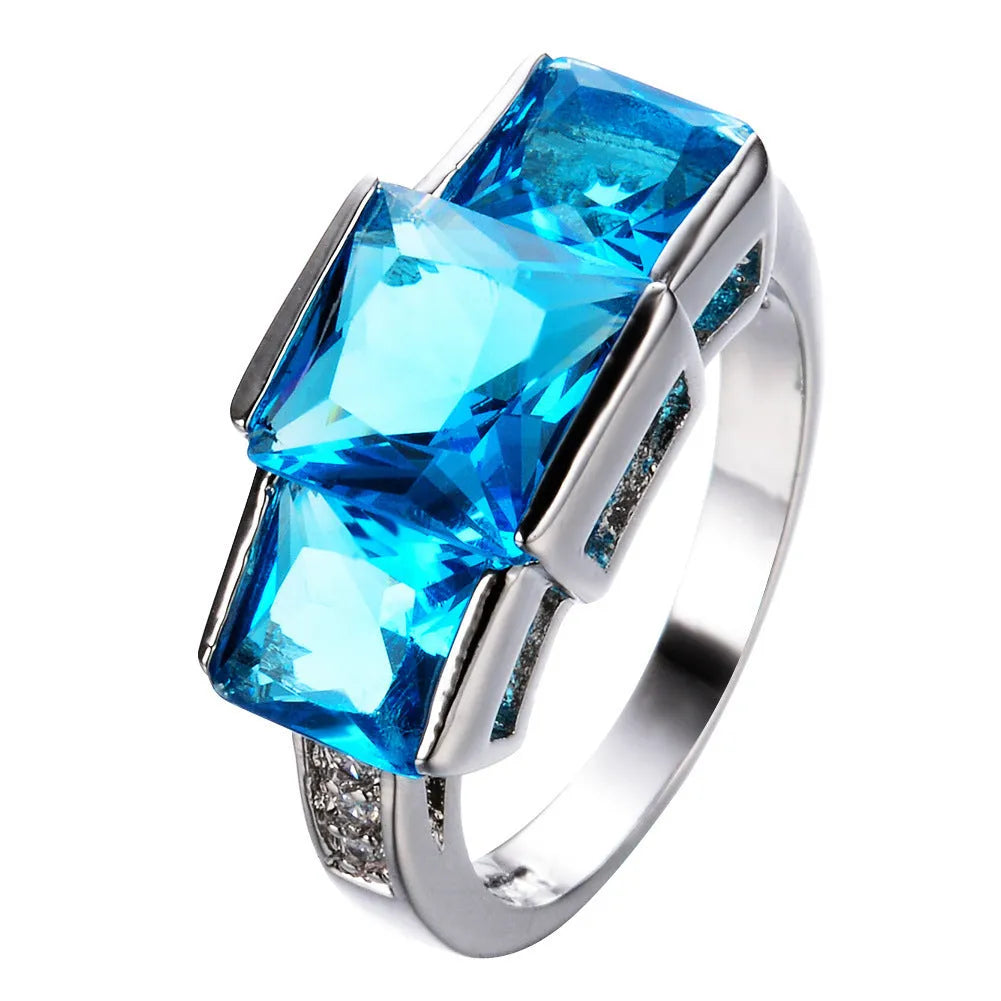 A set of colourful electroplated copper rings for women in sizes 6 to 10, showing apple green, champagne, and sapphire blue colours.