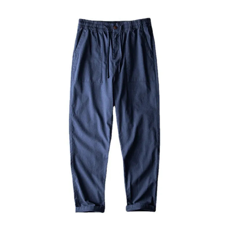Men's linen casual trousers in a solid colour, shown in navy blue, apricot, and grey options.